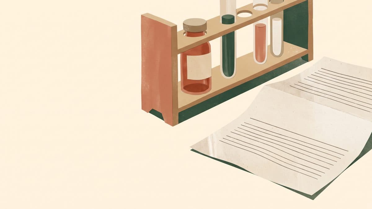 Paper-cut illustration of a rack of test tubes, one blood vial and a blank lab report sheet